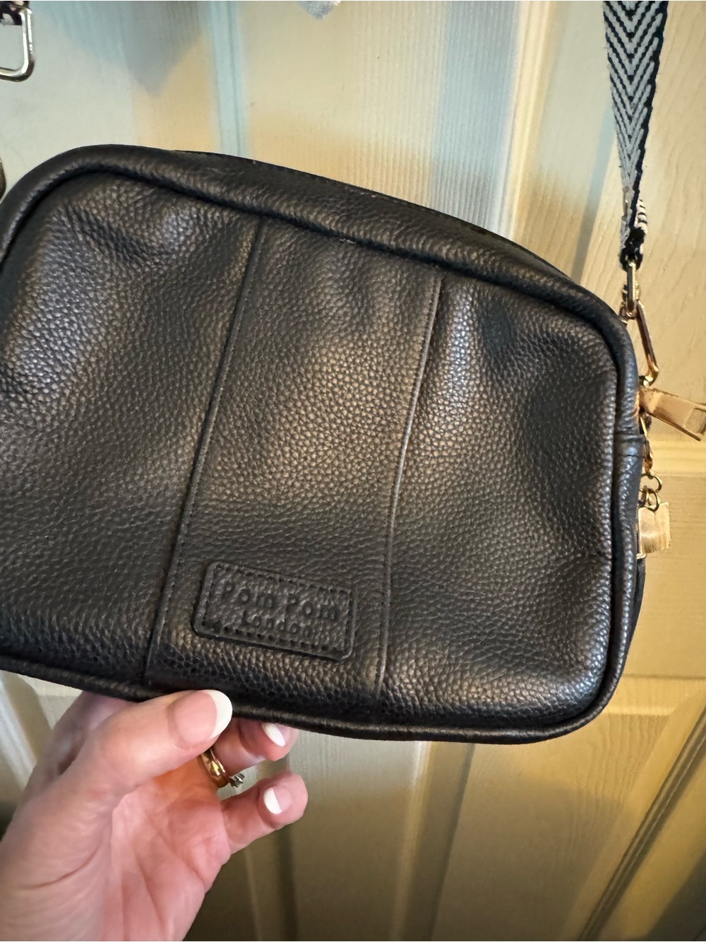 Black Pebbled Leather Crossbody with Logo Patch by Pom Pom